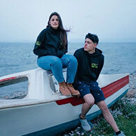 man-and-woman-sitting-on-boat