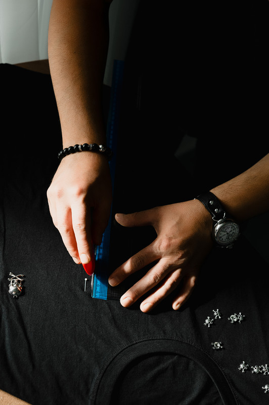 Measuring neckline on black tee