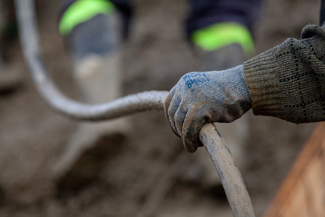Plumber's hands working on a pipe connection