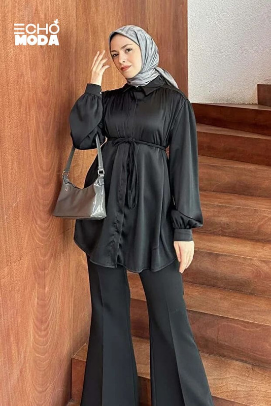 بلوزة خروج ناعمة بأكمام منفوخة وتفاصيل بسيطة تمنحك مظهراً شيكاً ومحتشماً. بلوزة خروج ناعمة بأكمام منفوخة وتفاصيل بسيطة تمنحك مظهراً شيكاً ومحتشماً.