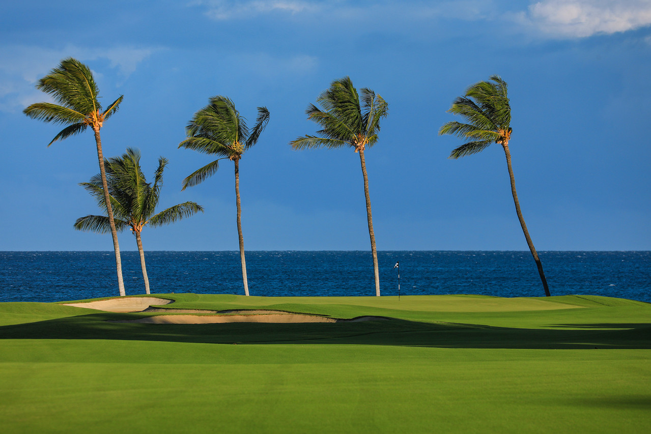 The second hole at Mauna Lani North Course, framed by kiawe forest and ancient lava