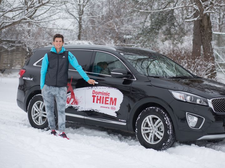 Dominic with his Kia car