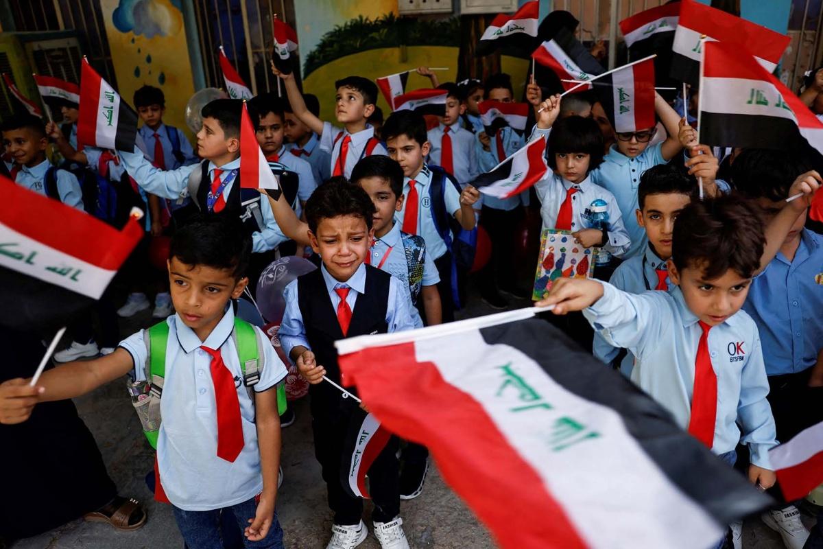 Iraqi students returning to school in Baghdad