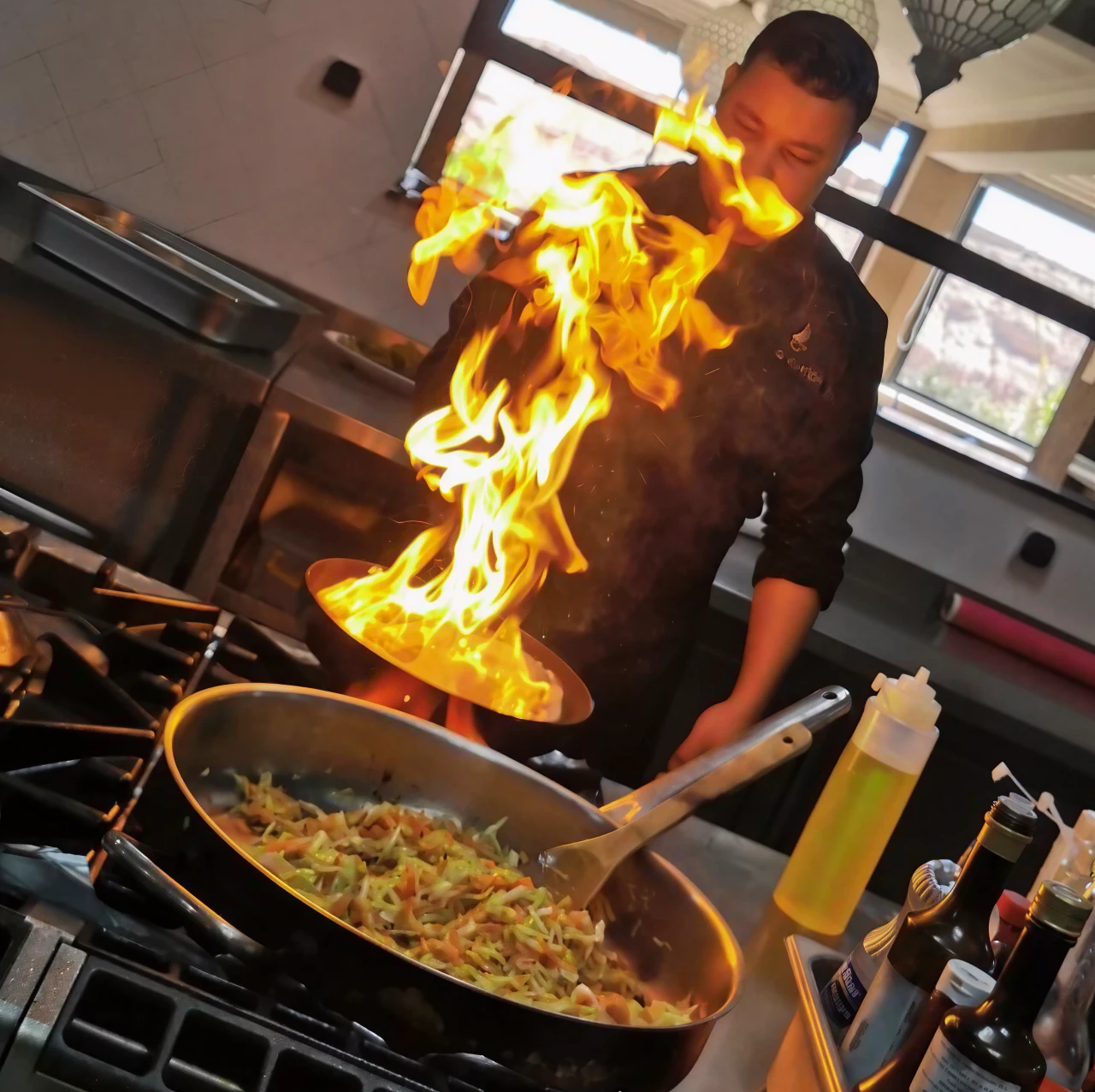 Chef Driss cooking flambé at Sunset Restaurant