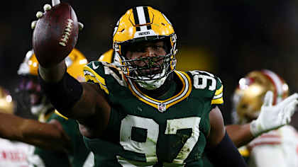 Kenny Clark celebrating a tackle on the field