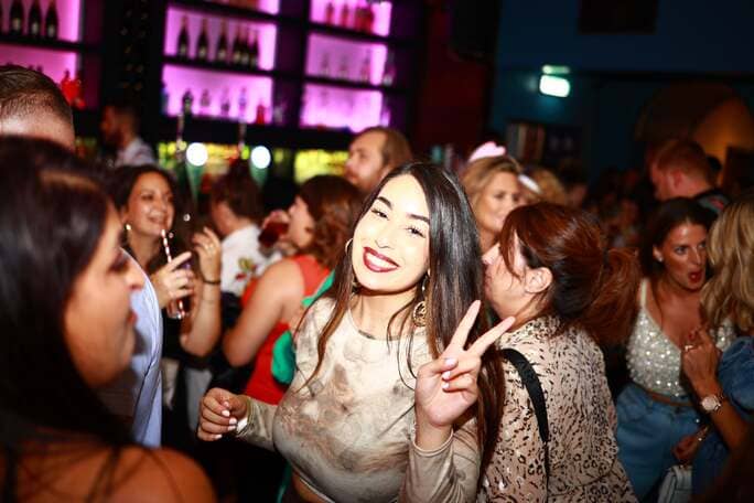 Women smiling and dancing at Dorothys