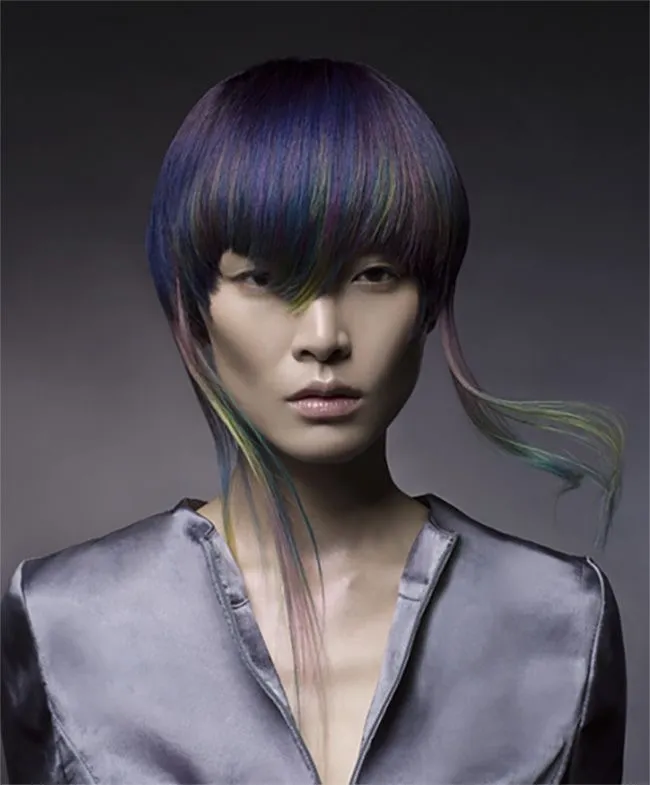 Short Jellyfish haircut on thick tinted purple green hair