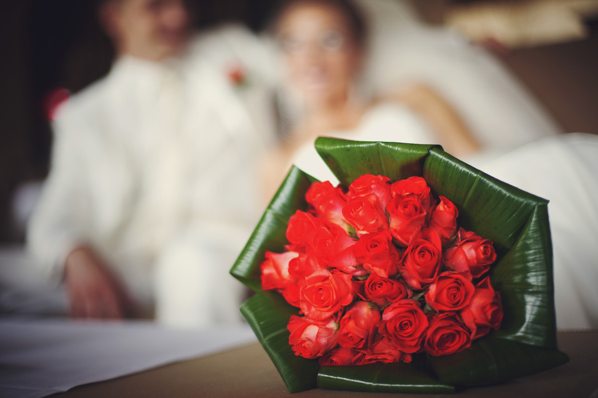 red wedding bouquet lies table