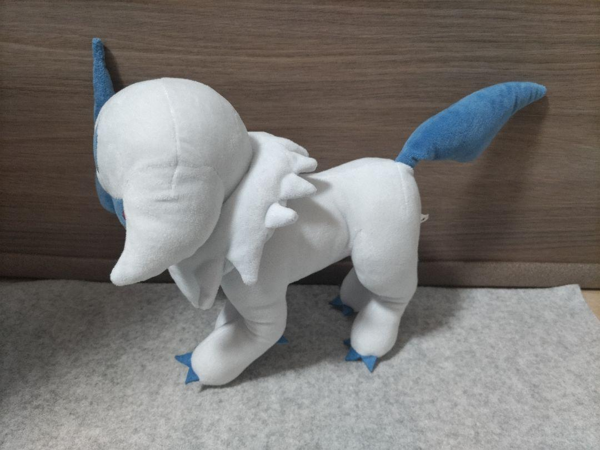 The Absol plush facing to the left