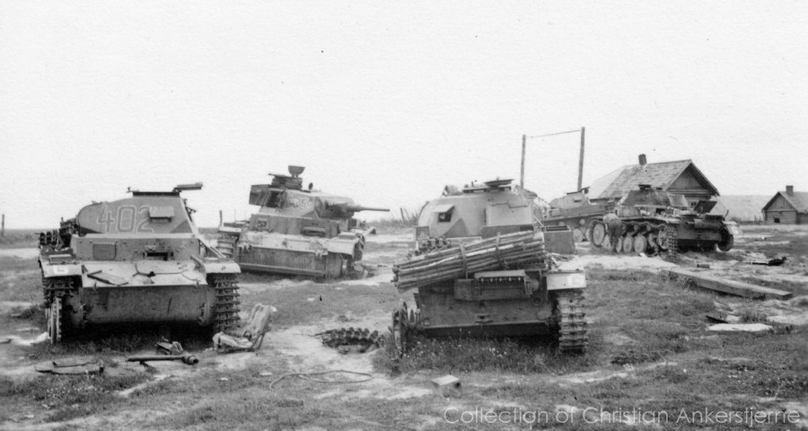 Knocked-out Pz Kpfw III Ausf. G (tactical number 235) and Pz Kpfw II Ausf. C (left-most, tactical nu