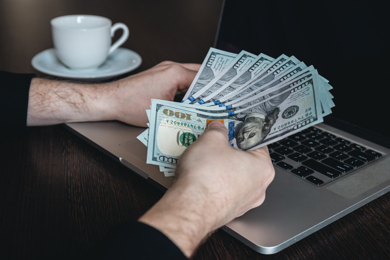 closeup dollar bills male hands concept making money working