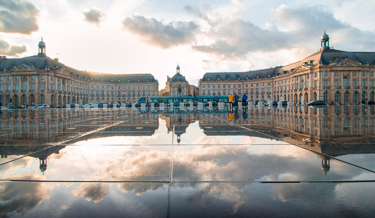 Place de la Bourse in Bordeaux with reflection on the Miroir d'eau at sunset