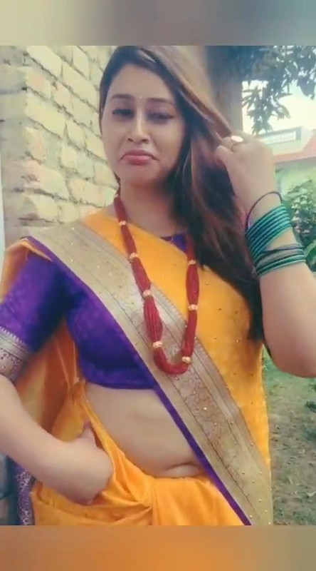Beautiful Nepali Aunty Sexy open Big Deep Navel in Orange Saree.mp4_snapshot_00.07.775