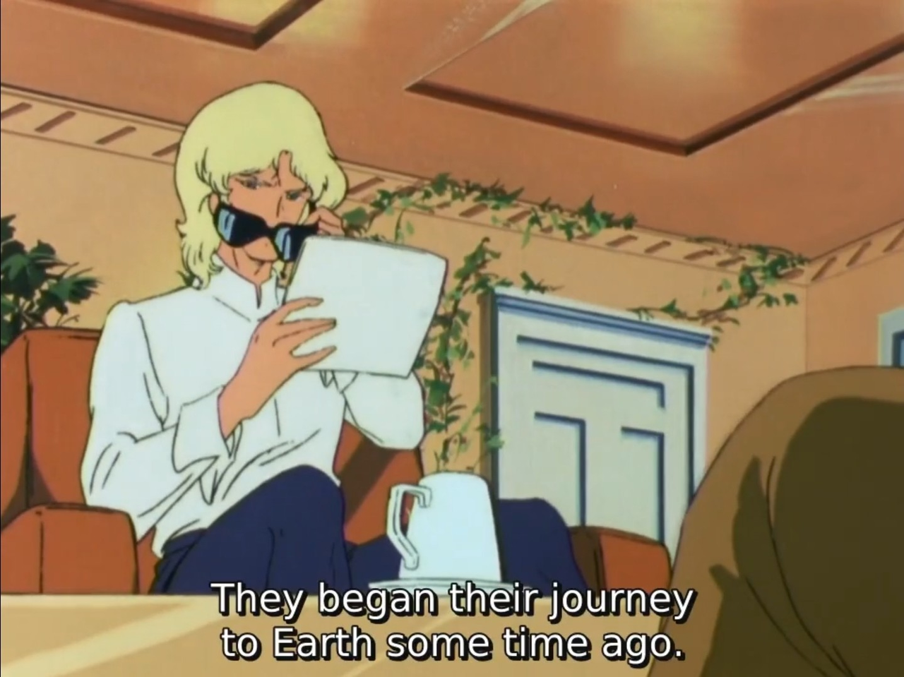 Char lowers his sunglasses to get a better look as his interlocutor continues, "They began their journey to Earth some time ago."