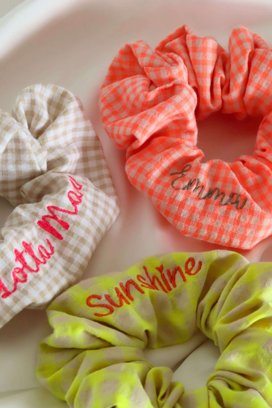Make your hair accessory truly yours with a personalised embroidered scrunchie from Lotta Mae Barcelona. Choose your own name, text or initials - hand-embroidered onto a soft, stretchy scrunchie. Perfect as a gift, for weddings, bachelorette parties or just for yourself. Available in a range of fabric and thread colours.