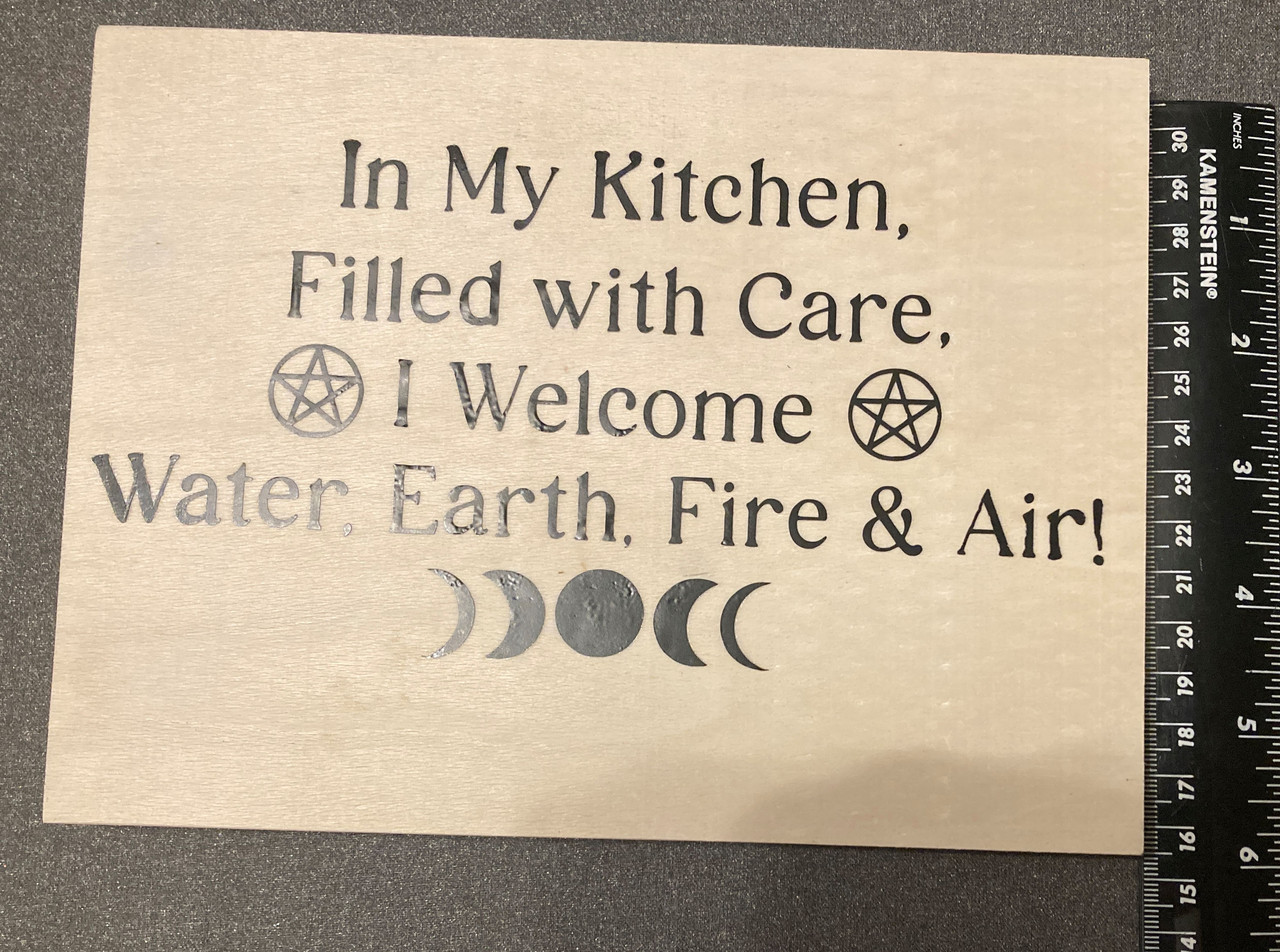 handcrafted elemental kitchen sign