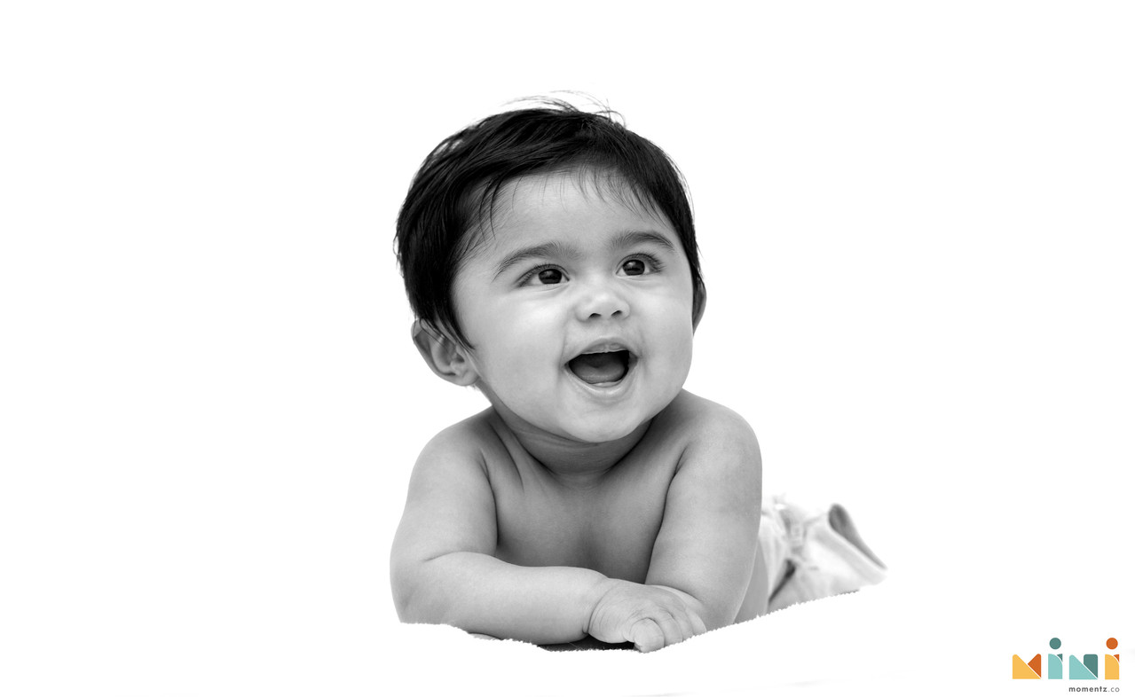 Tamil family photographer UK — intimate family portrait at home, natural light
