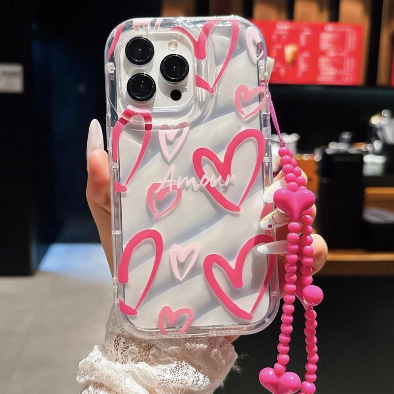 Foto de Funda transparente con diseño corazón. Incluye correa de mano.