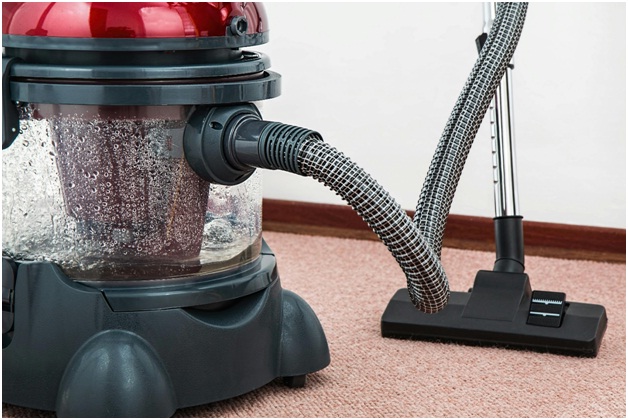 A vacuum cleaner with a red top

AI-generated content may be incorrect.