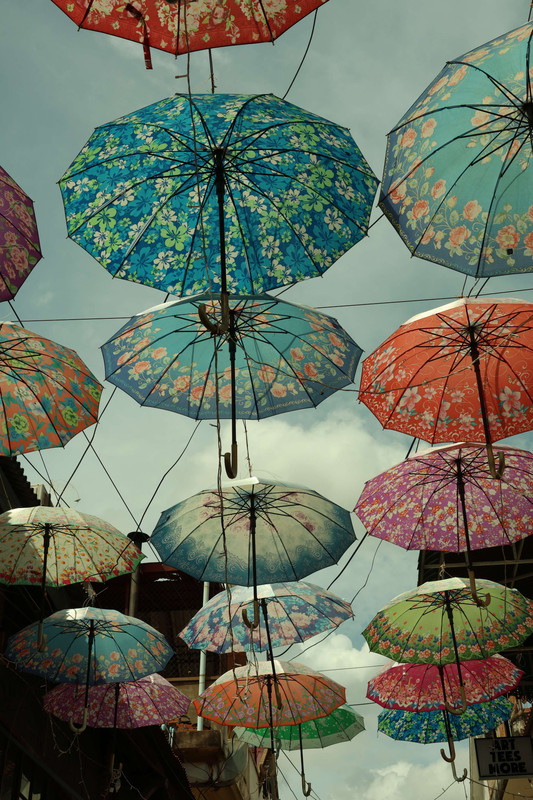 Sample photo taken with the Canon EOS R8 Mark II, colourful umbrellas overhead