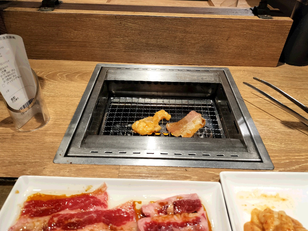 Grilled short ribs sizzling on a personal yakiniku grill