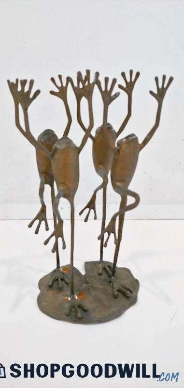 a product photo of a brass statue of four thin-limbed frogs all standing on one foot and reaching their hands up