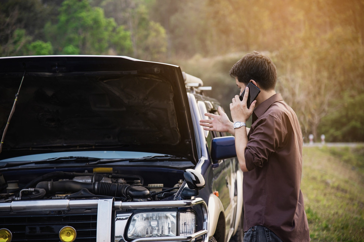 man-try-fix-car-engine-problem-local-road-2