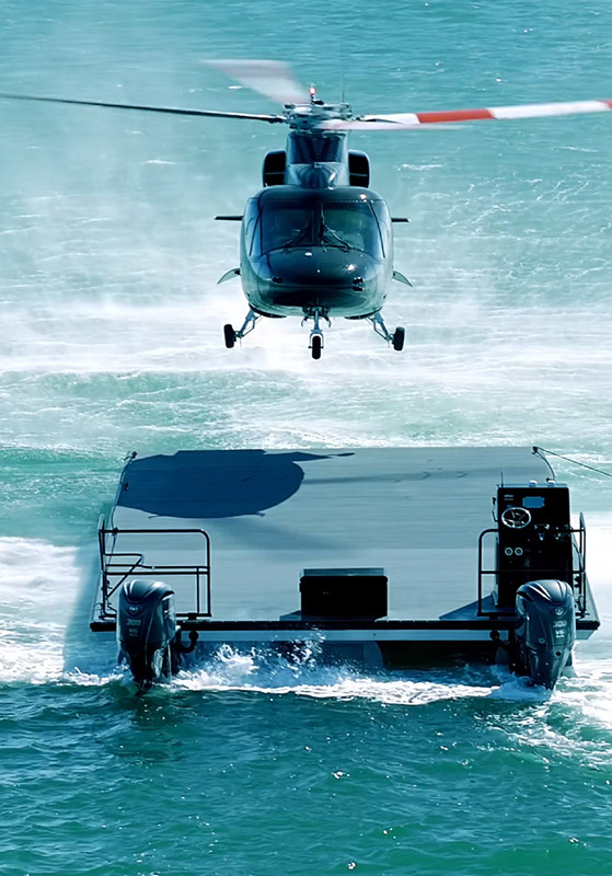 Front view of helicopter landing on floating helipad in Miami