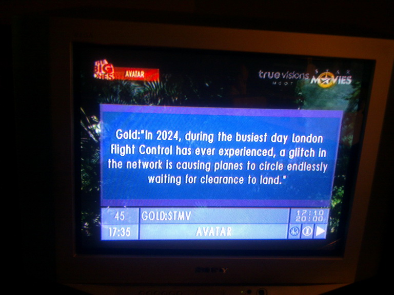 Full-screen EPG over James Cameron's Avatar, airing with a special extra 'The Big Ones' logo: 'In 2024, during the busiest day London Flight Control has ever experienced, a glitch in the network is causing planes to circle endlessly waiting for clearance to land.' Now without extra added text