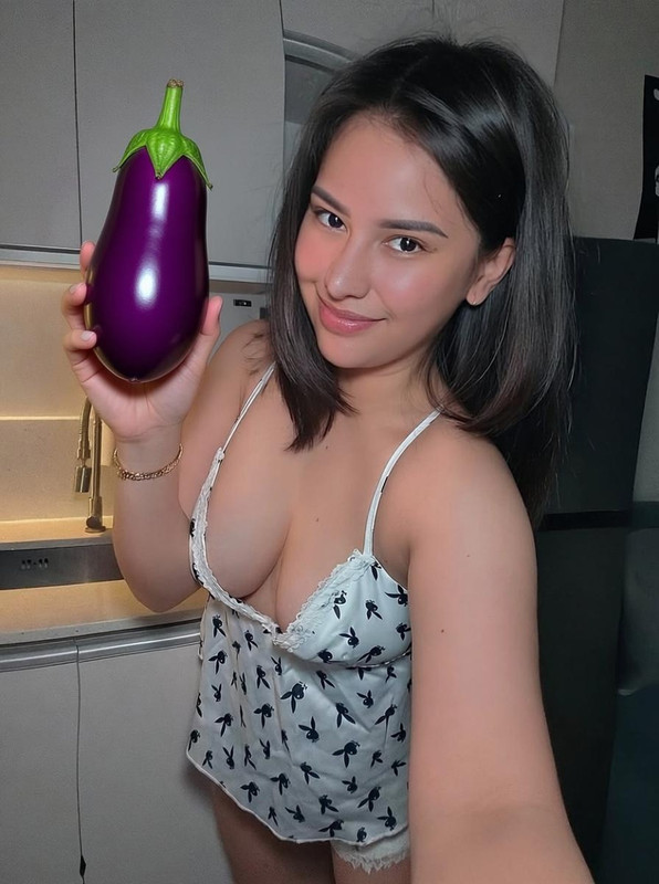 grok image change the item her holding to an eggplant 448a0da0 8607 436c 8282 62a3ab9e05aa image edi
