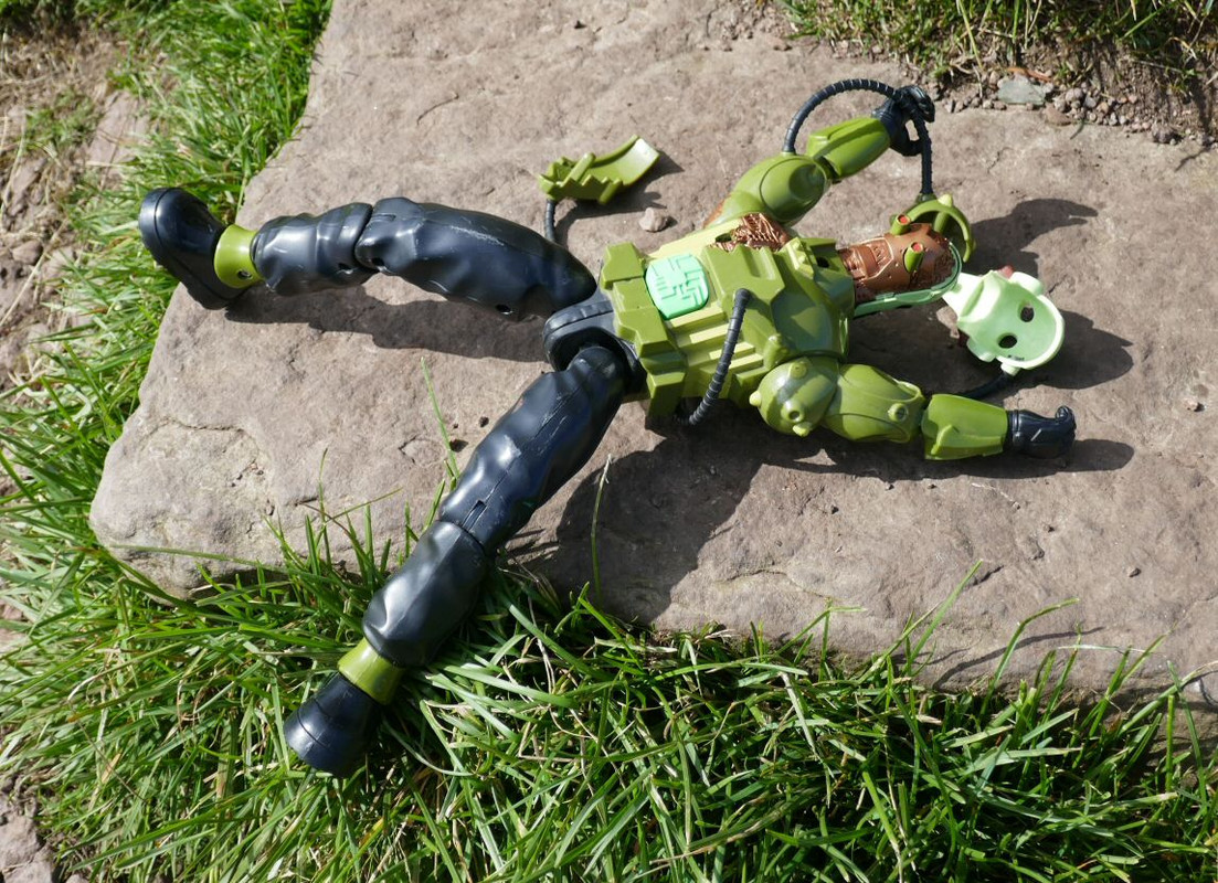 Green Robot climbing the stone marker post at Allermuir Hil. 9211-FFA2-8-B48-491-A-93-C0-AFCDE5-B7947-D