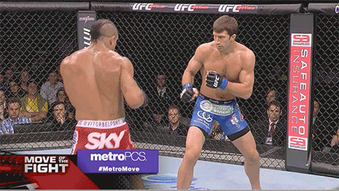 Vitor-Belfort-spinning-back-heel-kick-vs-knocks-out-Luke-Rockho.gif