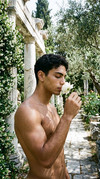 Man-smelling-flower-202604080718-1