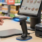 Leitor Tanca TL-120 sendo usado em um caixa de supermercado