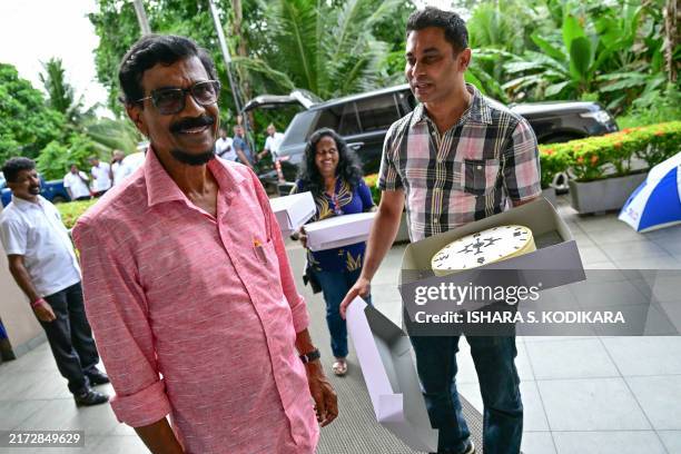 tilvin-silva-general-secretary-of-the-janatha-vimukthi-peramuna-party-gestures-as-he-stands-1.jpg