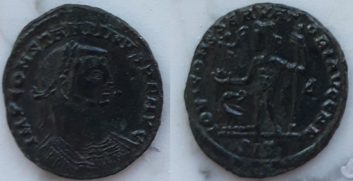 Nummus a nombre de Constantino I. IOVI CONSERVATORI AVGG NN. Júpiter estante a izq. Siscia C1sis4a
