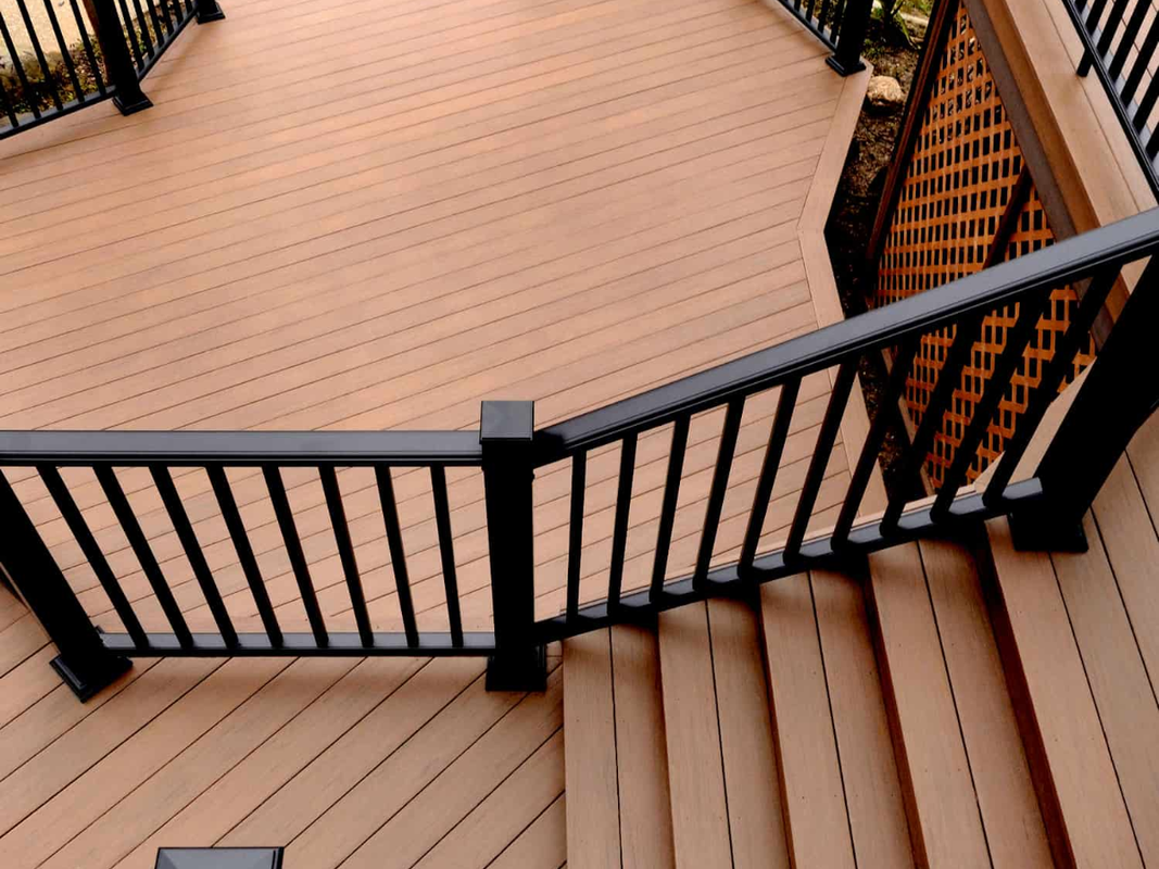 Poolside deck with pergola and lounge area