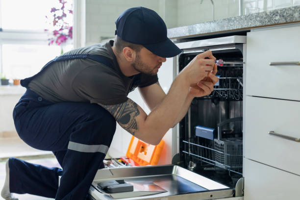 Technician checking fridge