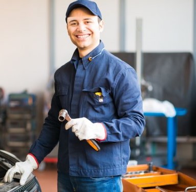 depositphotos-76739041-stock-photo-mechanic-holding-a-wrench.jpg