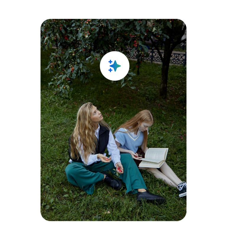 Two women posing at an office work area with warm color tones 1