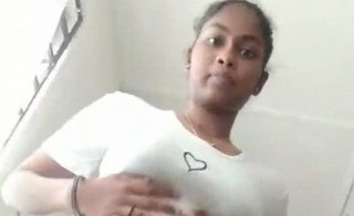 Stripping and toying with her pussy