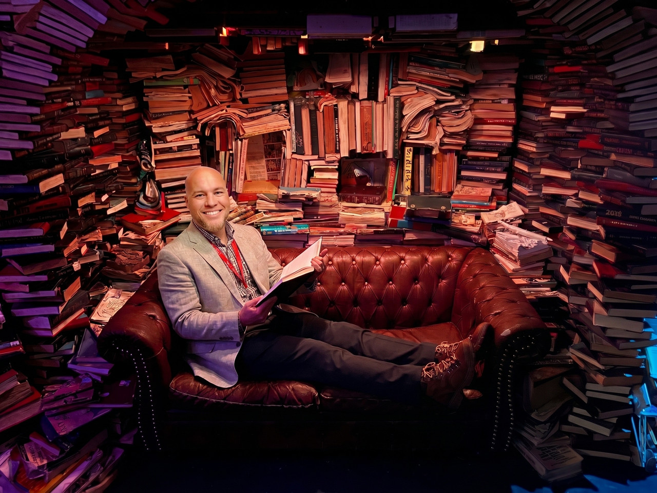 Robert Vickery II seated in private book archive