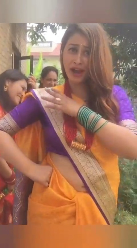 Beautiful Nepali Aunty Sexy open Big Deep Navel in Orange Saree.mp4_snapshot_00.26.464