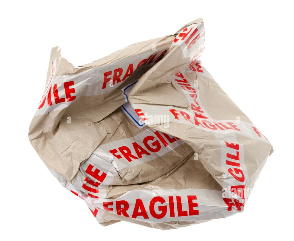 a-crushed-cardboard-box-that-was-marked-as-being-fragile-studio-shot-CW8RFT~2