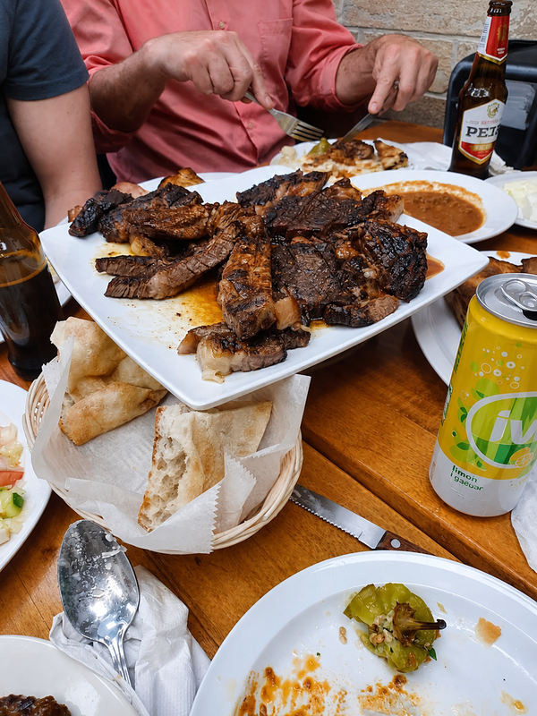 Grilled meat and Balkan dishes served family style at Besa Grill