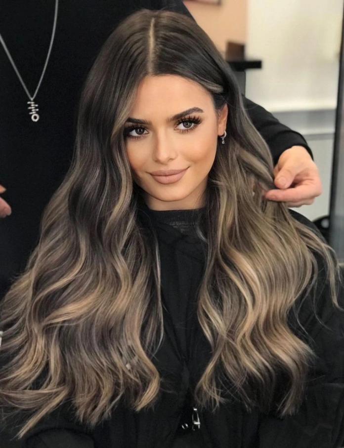 Ash blonde balayage on dark long hair