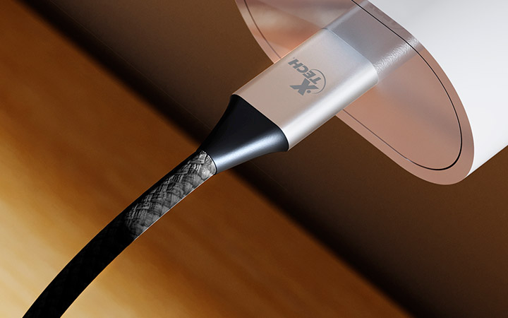 El cable Xtech USB-C a USB-C enrollado, mostrando su flexibilidad.