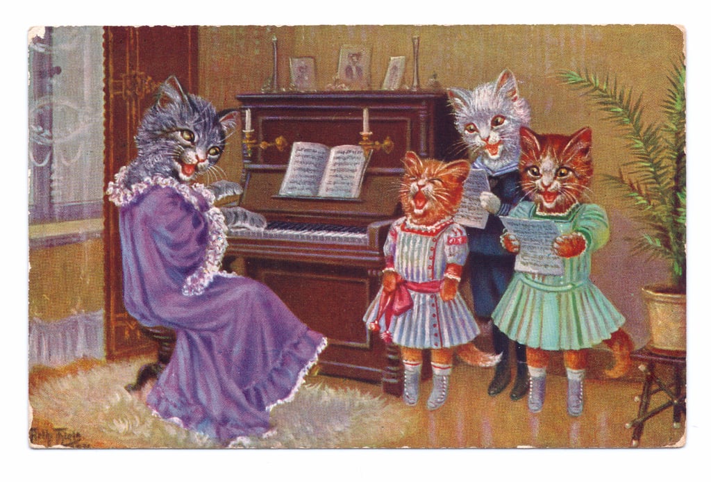 Louis-Wain-Edwardian-postcard-of-four-cats-wearing-human-clothes-around-a-piano-having-a-si-Mei