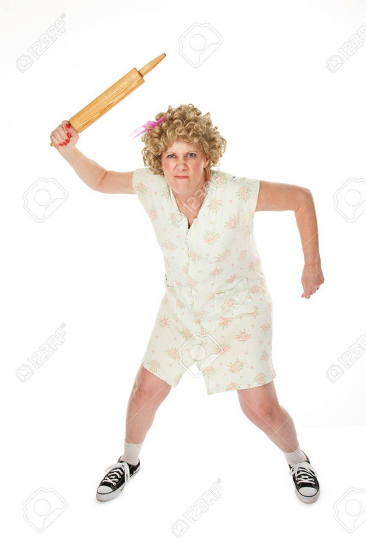 7434575-angry-housewife-with-rolling-pin-on-white-background