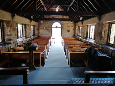 A side view of the church pews.